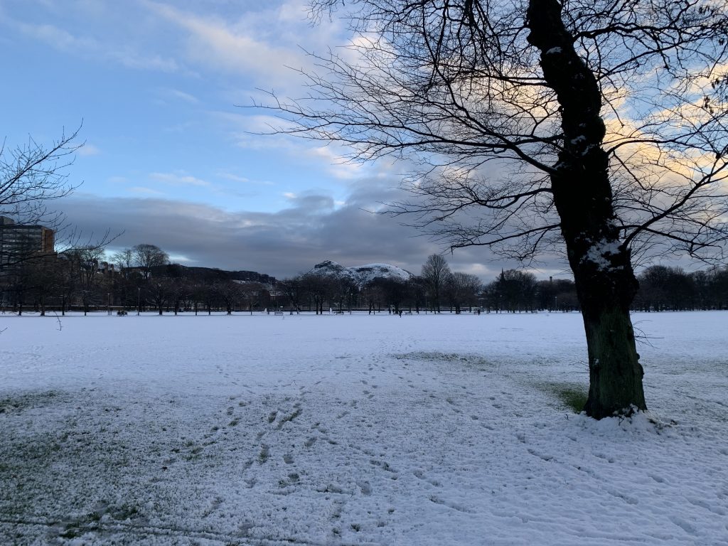 snowy Edinburgh park with mountain in the background - snow gives me complex emotions